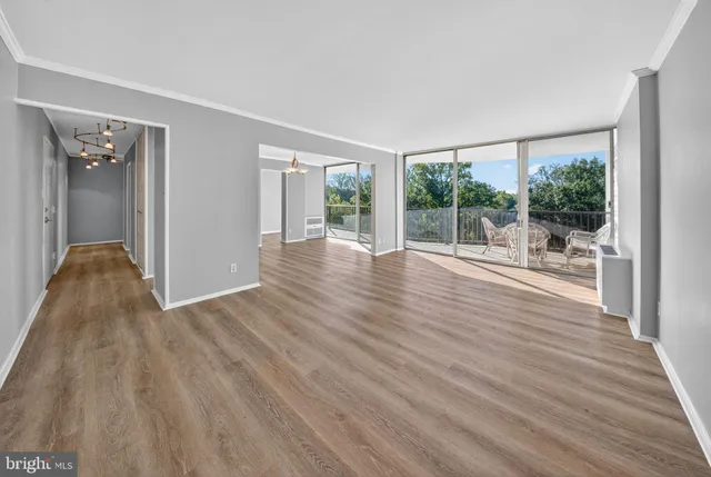 a view of a room with wooden floor and balcony