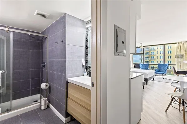 a bathroom with a tub and shower