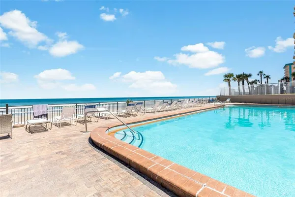a view of a swimming pool with a terrace