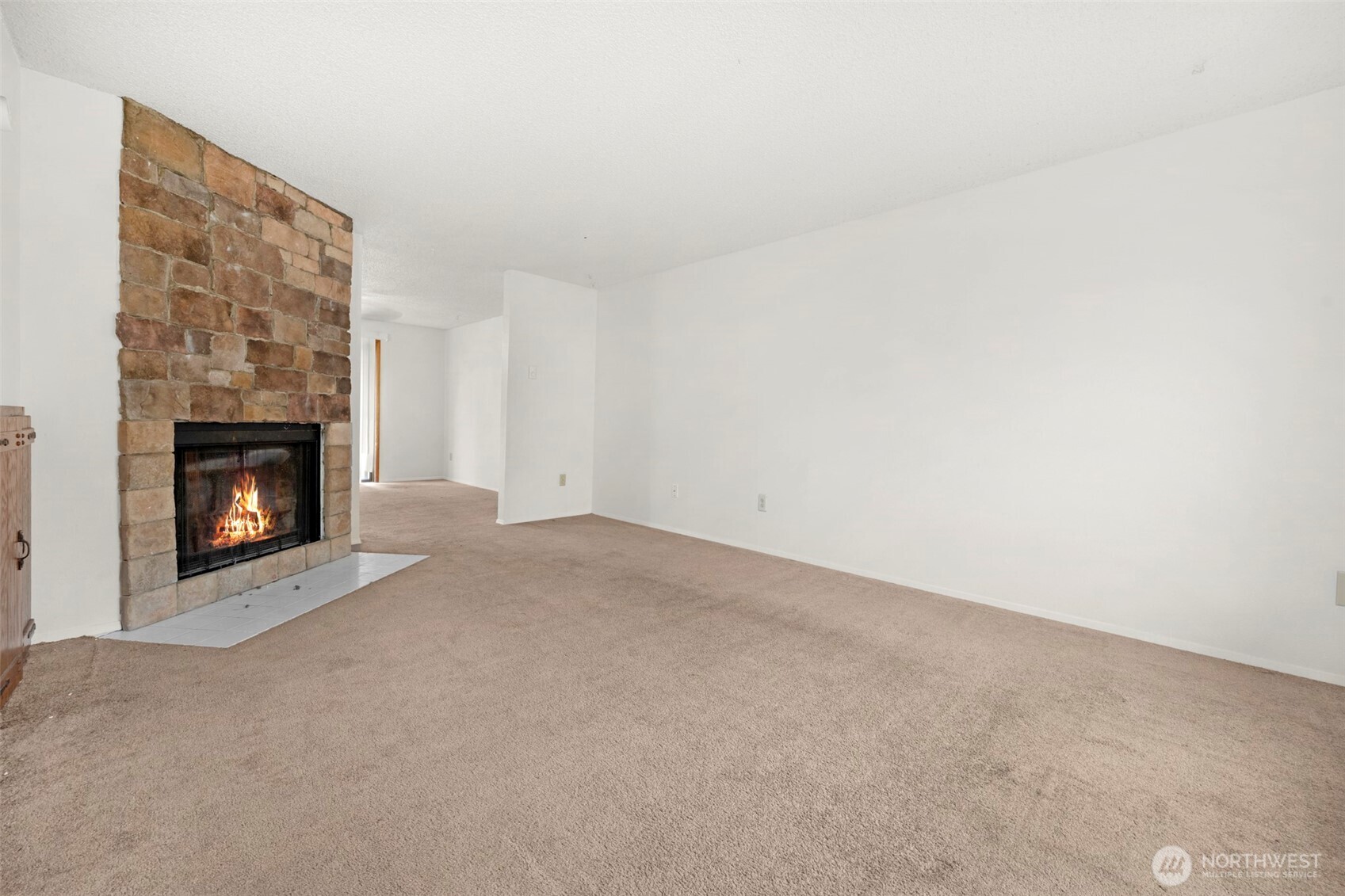 6920 Armar Road Marysville, WA 98270 - Photo 5 of 24 a view of an empty room with a fireplace