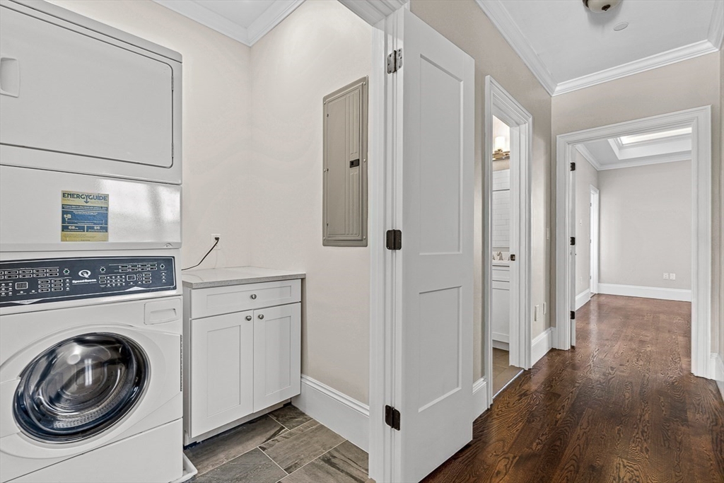 846 Main Street, Unit 3 Winchester, MA 01890 - Photo 18 of 36 a view of a hallway with washer and dryer