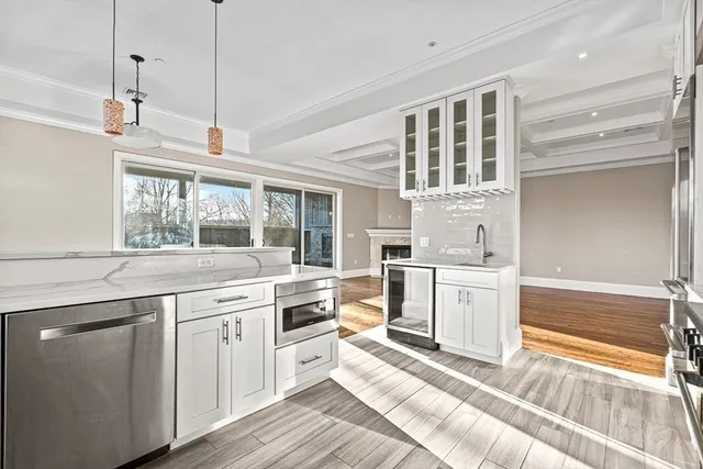 a kitchen with a stove a sink and cabinet
