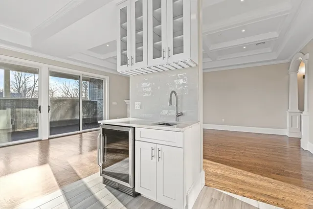 a kitchen with a sink and cabinets
