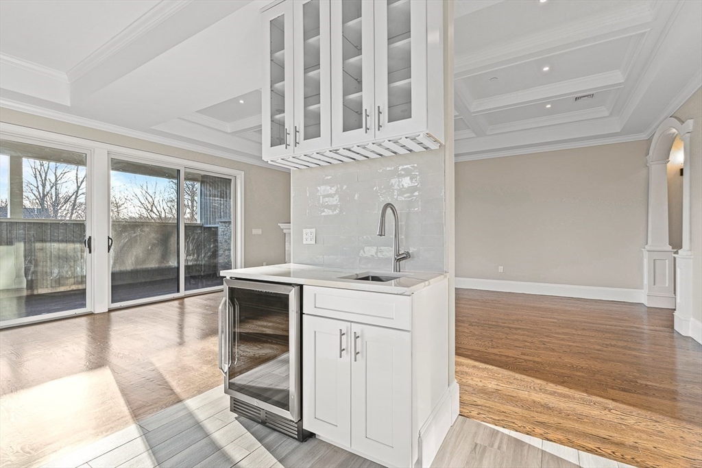 846 Main Street, Unit 3 Winchester, MA 01890 - Photo 24 of 36 a kitchen with a sink and cabinets