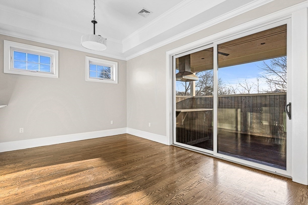 846 Main Street, Unit 3 Winchester, MA 01890 - Photo 27 of 36 a view of empty room with wooden floor and fan
