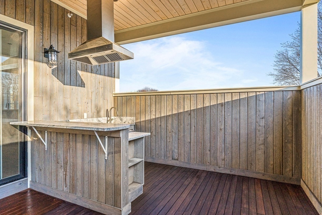 846 Main Street, Unit 3 Winchester, MA 01890 - Photo 30 of 36 a view of balcony with wooden floor and fence