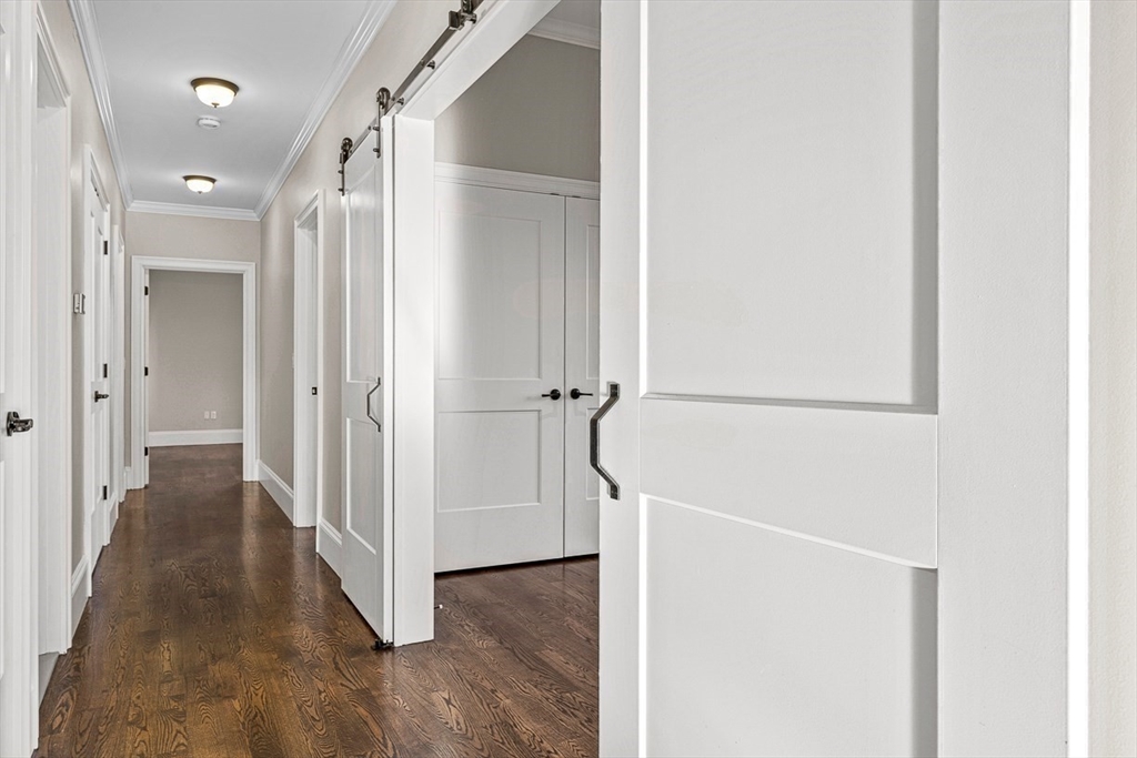 846 Main Street, Unit 3 Winchester, MA 01890 - Photo 7 of 36 a view of a hallway with wooden floor