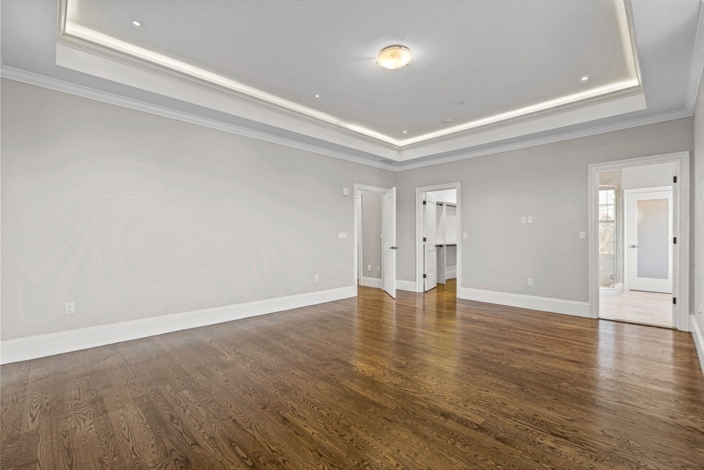 846 Main Street, Unit 3 Winchester, MA 01890 - Photo 9 of 36 a view of an empty room with wooden floor