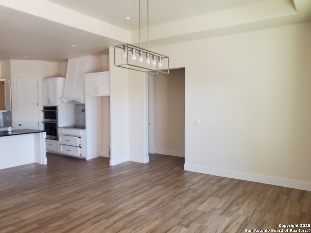 65 Nine Patch Drive Poteet, TX 78065 - Photo 3 of 14 a view of a kitchen with wooden floor