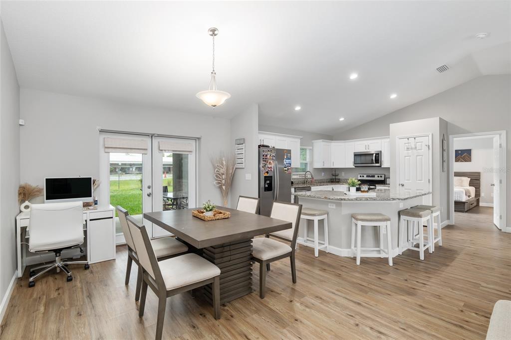 12 Oak Circle Pass Ocala, FL 34472 - Photo 13 of 50 a kitchen with a dining table chairs and view living room