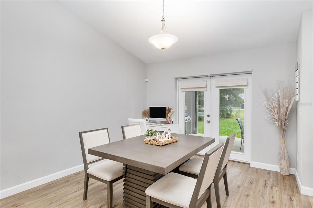 12 Oak Circle Pass Ocala, FL 34472 - Photo 14 of 50 a view of a dining room with furniture window and wooden floor