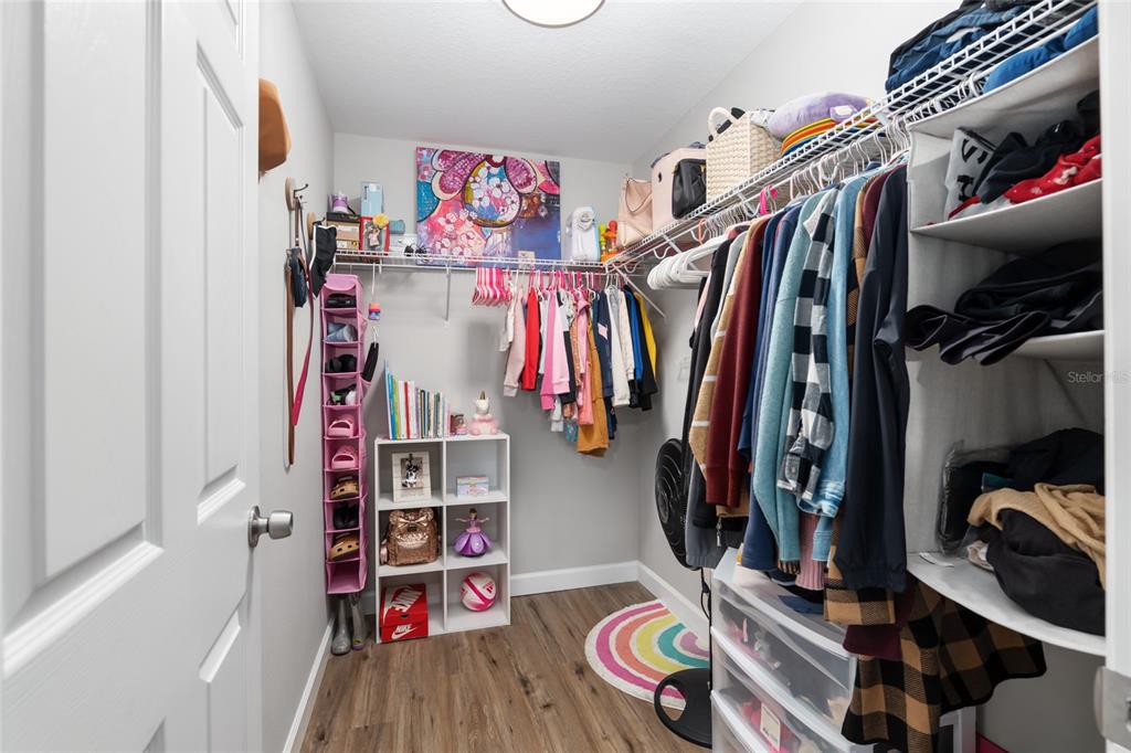 12 Oak Circle Pass Ocala, FL 34472 - Photo 30 of 50 a view of walk in closet with clothes and shoes