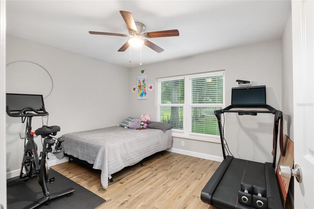 12 Oak Circle Pass Ocala, FL 34472 - Photo 31 of 50 a bedroom with a bed and a window