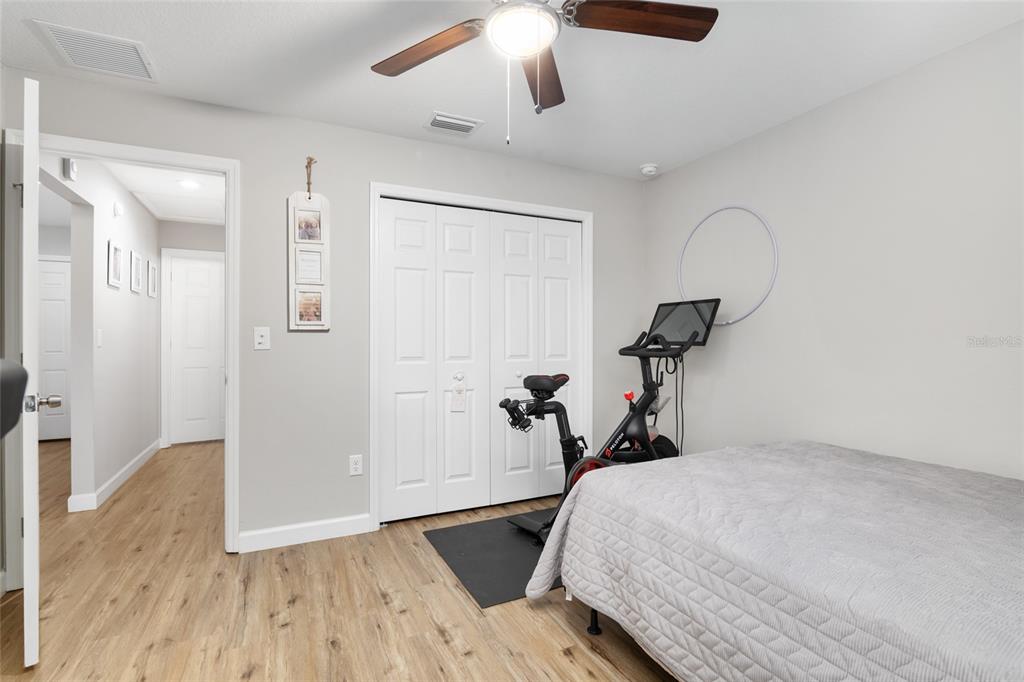 12 Oak Circle Pass Ocala, FL 34472 - Photo 32 of 50 a bed room with a bed and a chandelier