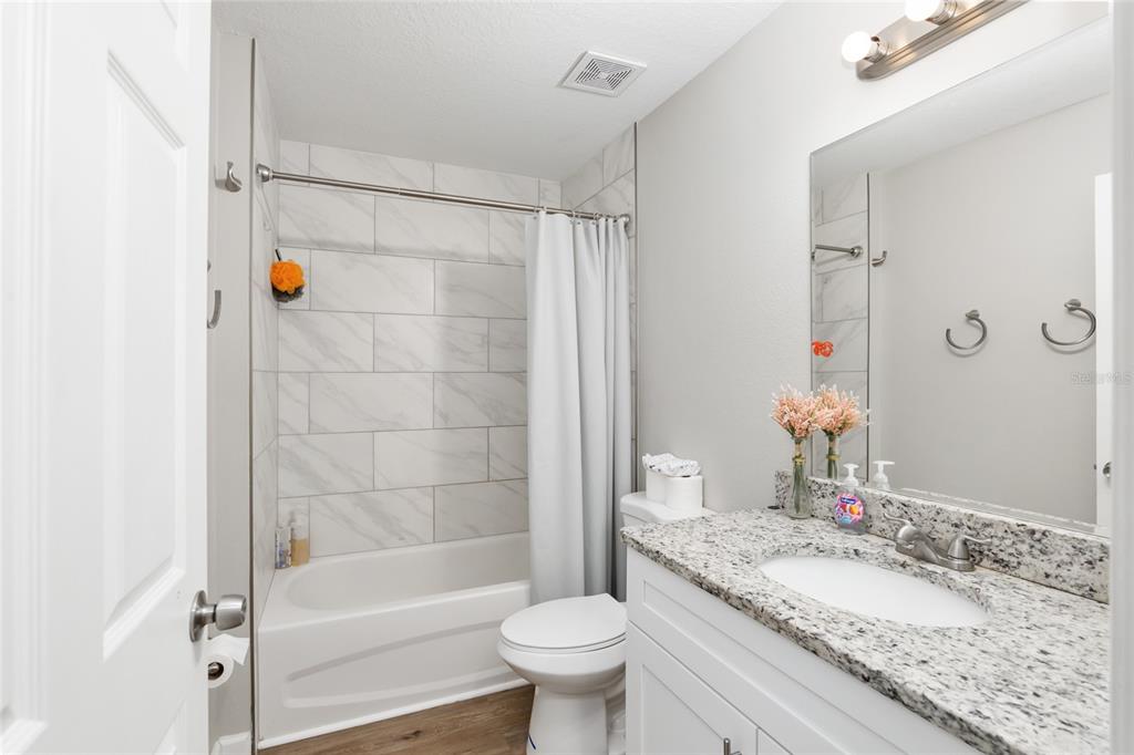 12 Oak Circle Pass Ocala, FL 34472 - Photo 33 of 50 a bathroom with a sink a toilet and shower