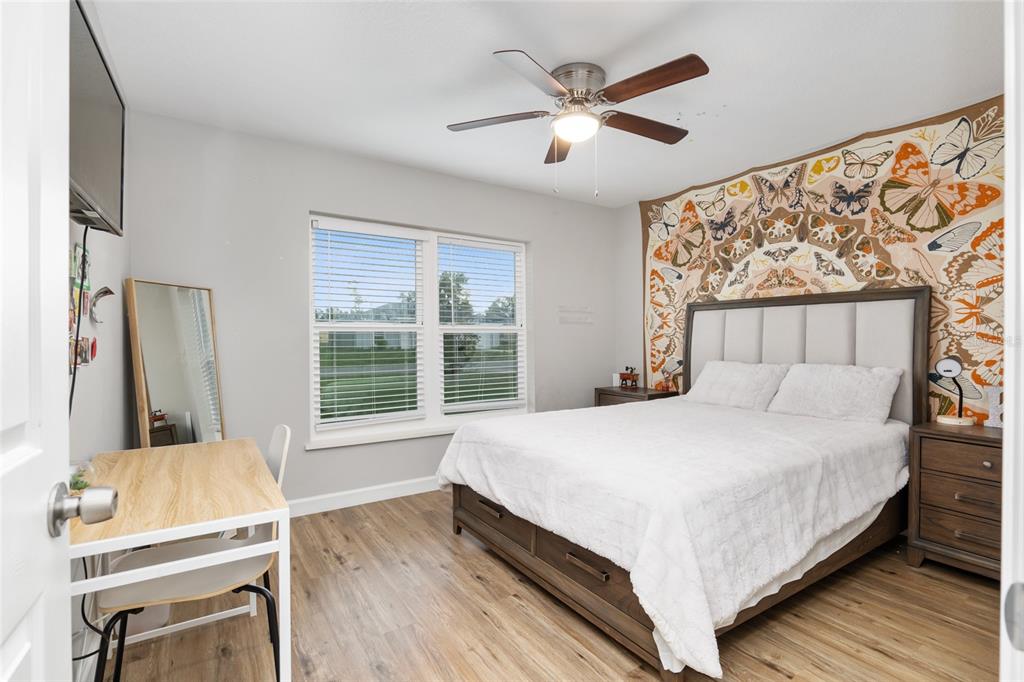 12 Oak Circle Pass Ocala, FL 34472 - Photo 34 of 50 a bedroom with a large bed and a window