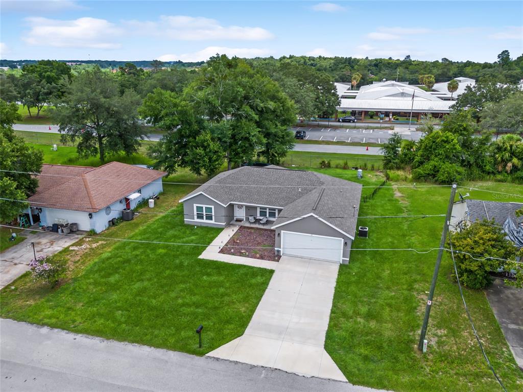12 Oak Circle Pass Ocala, FL 34472 - Photo 45 of 50 a view of a house with a yard and a garden