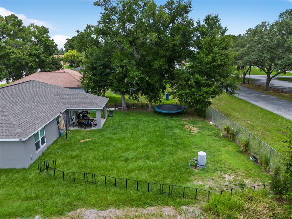 12 Oak Circle Pass Ocala, FL 34472 - Photo 47 of 50 a view of an house with backyard space and garden