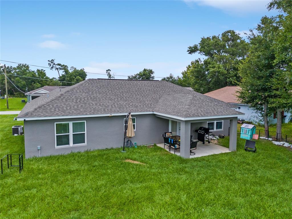 12 Oak Circle Pass Ocala, FL 34472 - Photo 48 of 50 a front view of a house with garden