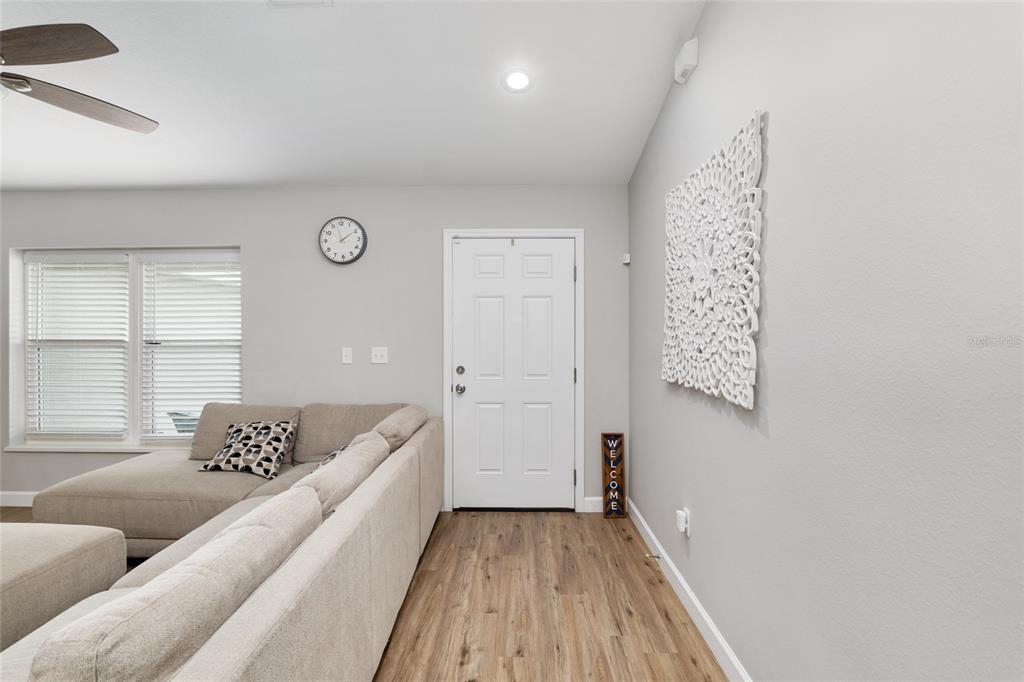 12 Oak Circle Pass Ocala, FL 34472 - Photo 7 of 50 a spacious bedroom with a bed and wooden floor