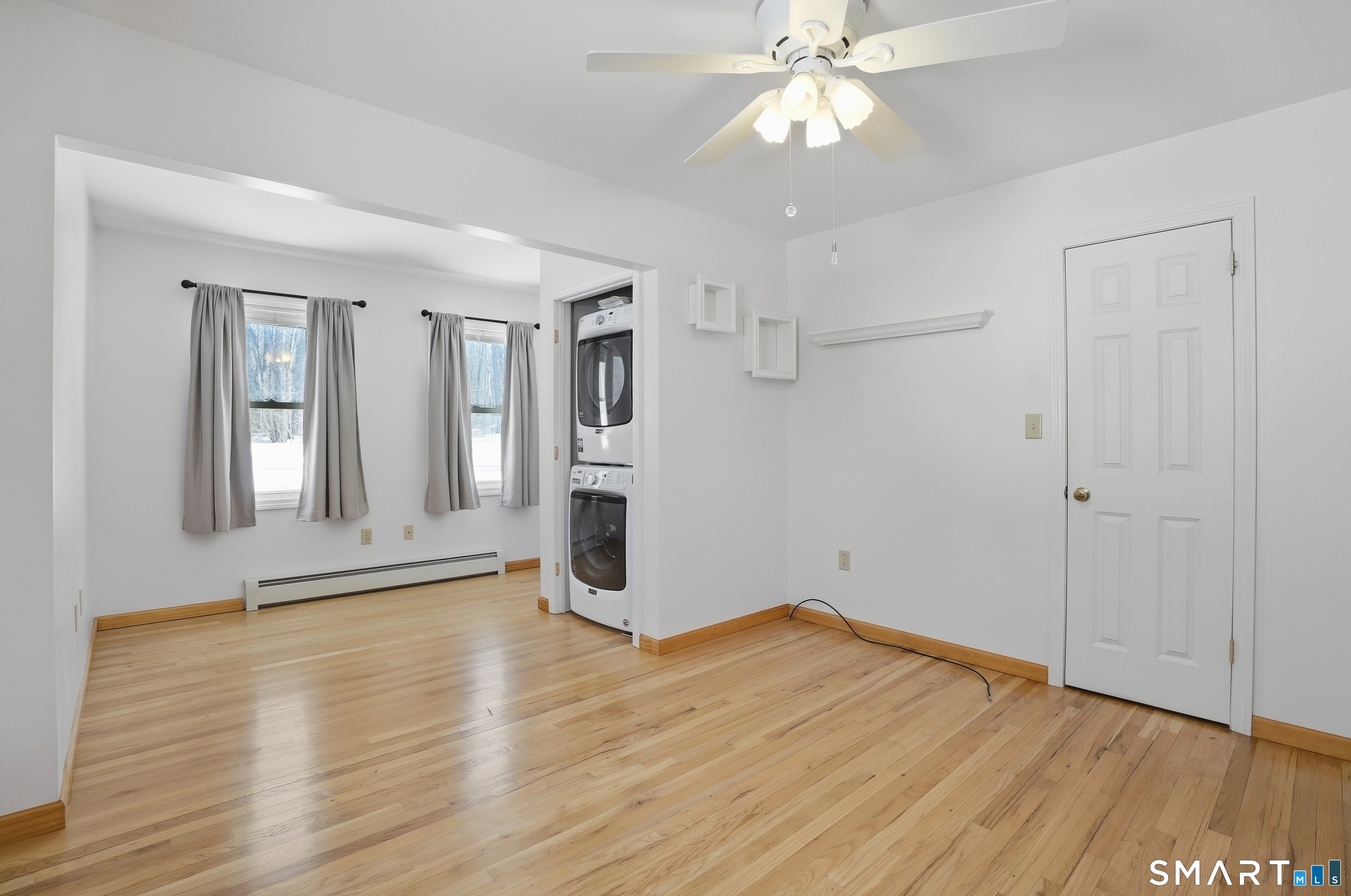 36 Longview Terrace Naugatuck, CT 06770 - Photo 17 of 29 an empty room with wooden floor and windows