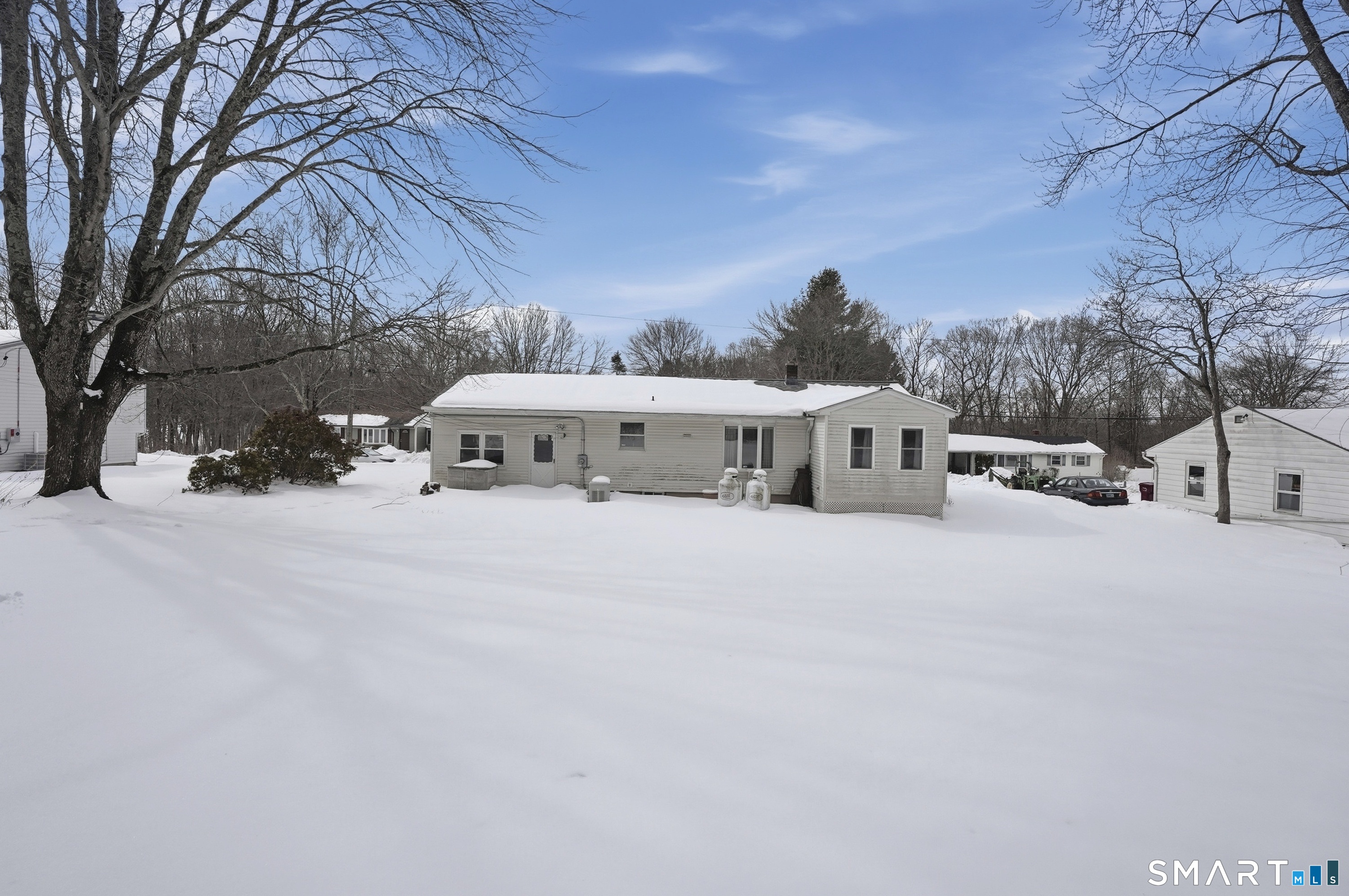 36 Longview Terrace Naugatuck, CT 06770 - Photo 22 of 29 a white house that has a tree in front of it