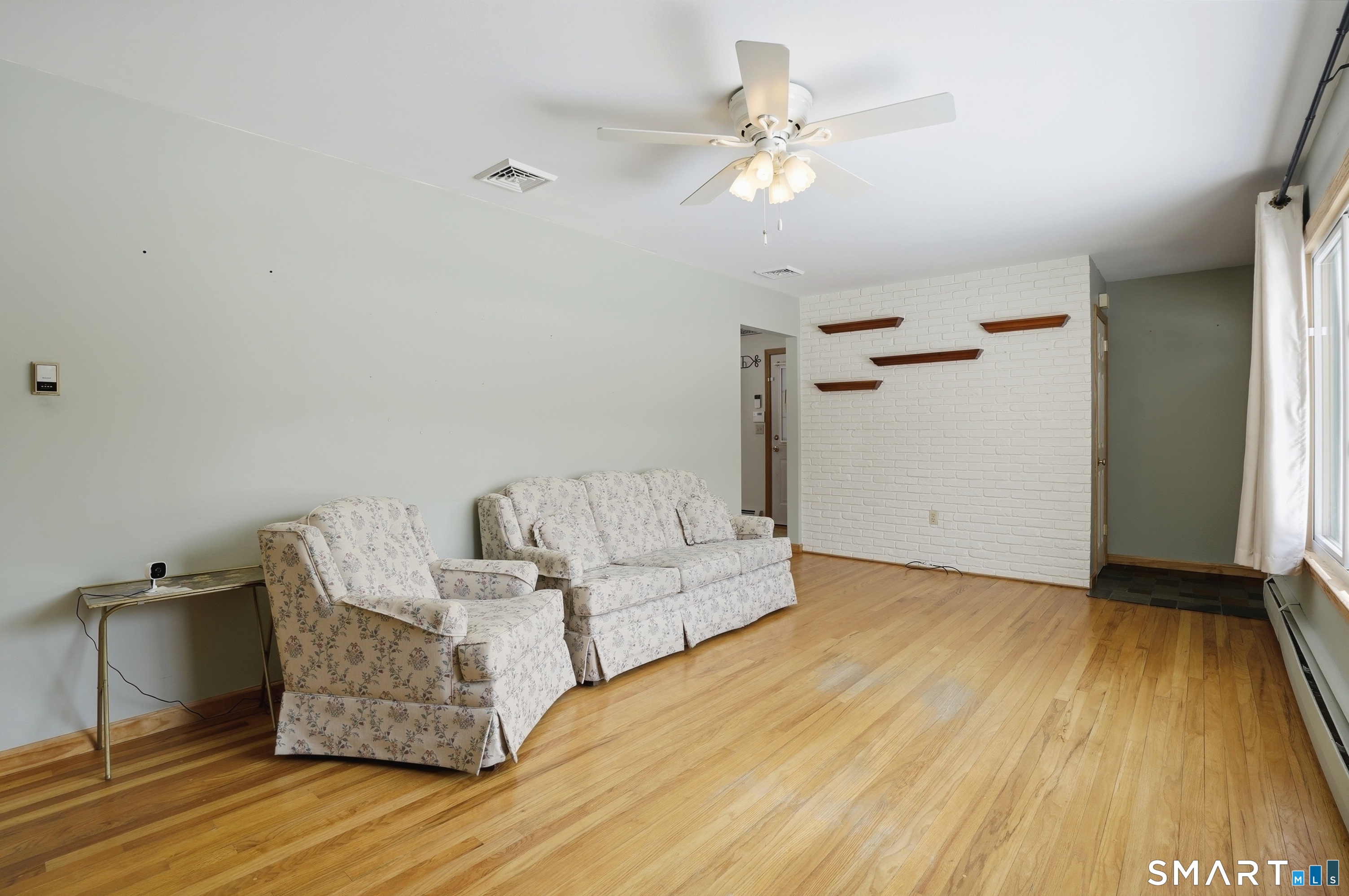 36 Longview Terrace Naugatuck, CT 06770 - Photo 3 of 29 a living room with furniture and a wooden floor