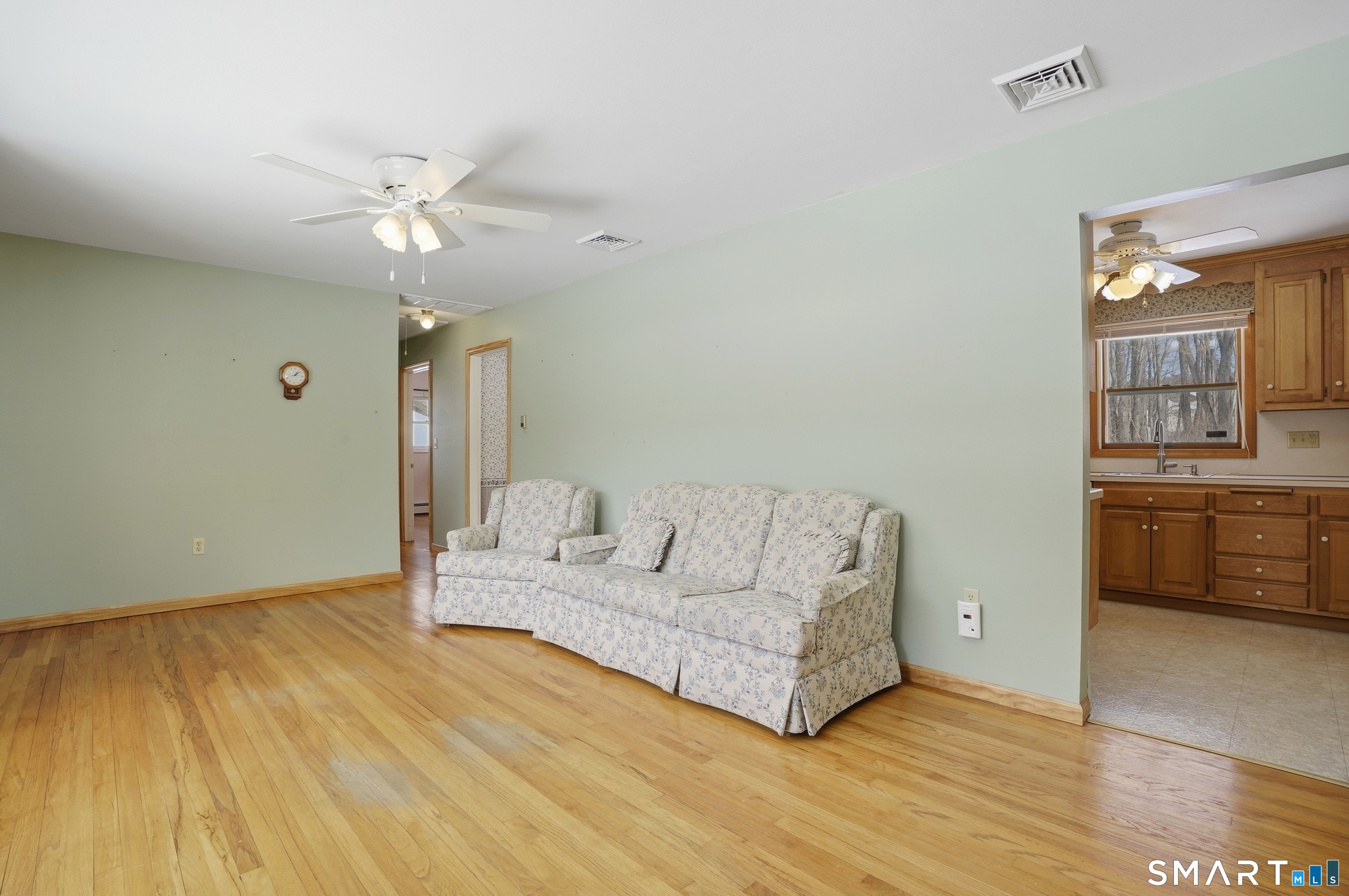 36 Longview Terrace Naugatuck, CT 06770 - Photo 5 of 29 a living room with furniture and a chandelier