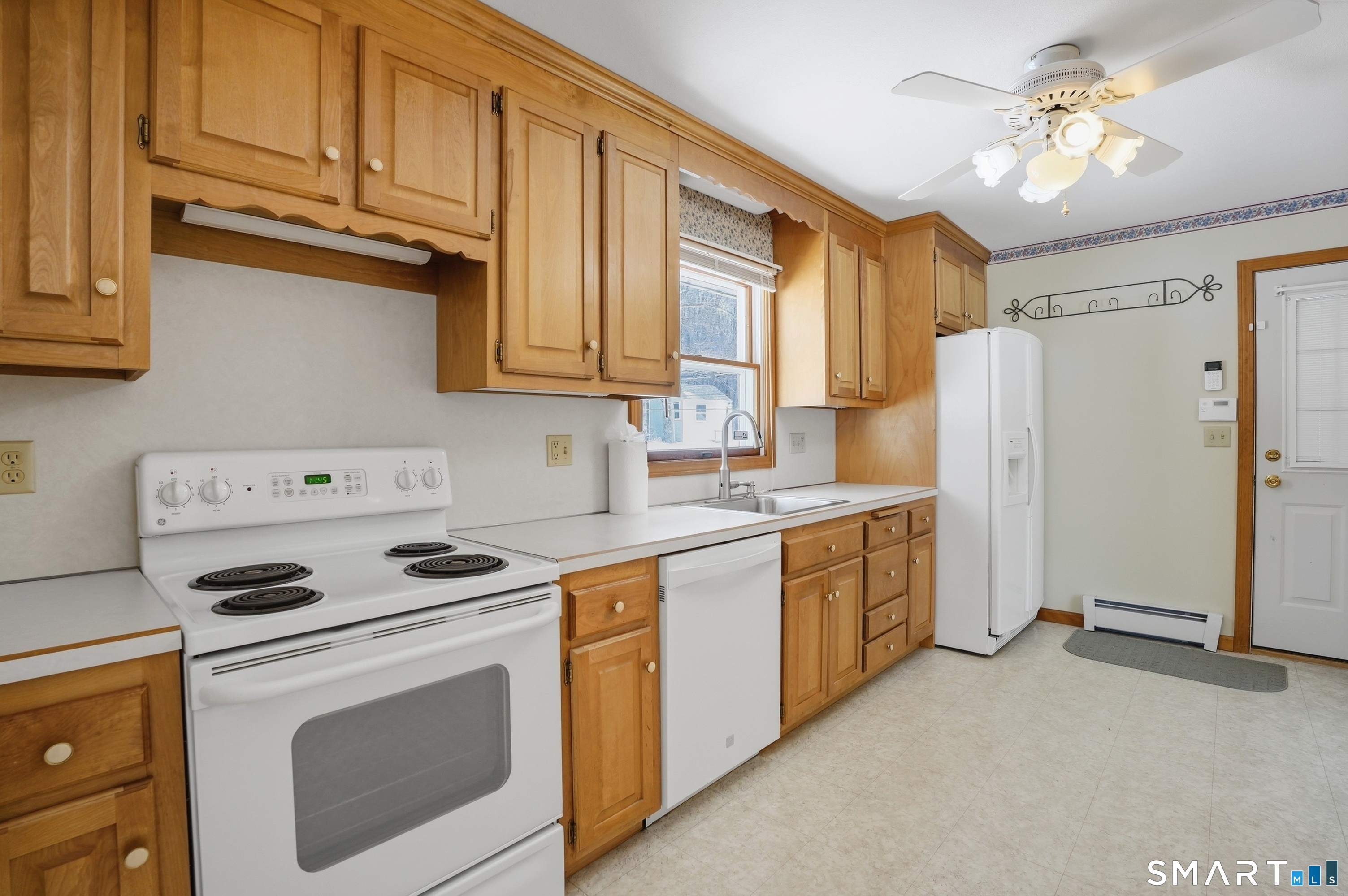 36 Longview Terrace Naugatuck, CT 06770 - Photo 8 of 29 a kitchen with stainless steel appliances a stove a sink and a refrigerator