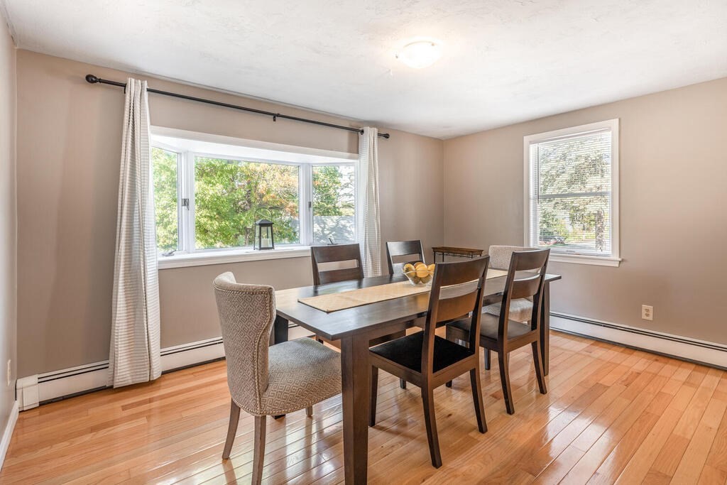 172 Virginia Road Waltham, MA 02453 - Photo 12 of 26 a view of a dining room with furniture and wooden floor