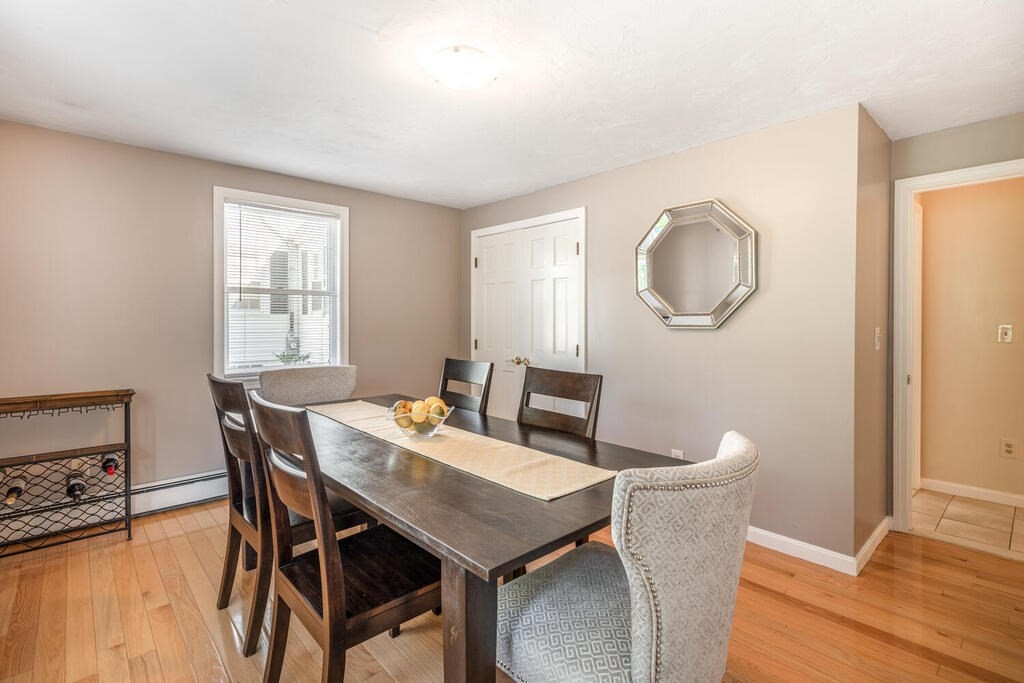 172 Virginia Road Waltham, MA 02453 - Photo 13 of 26 a view of a dining room with furniture and wooden floor
