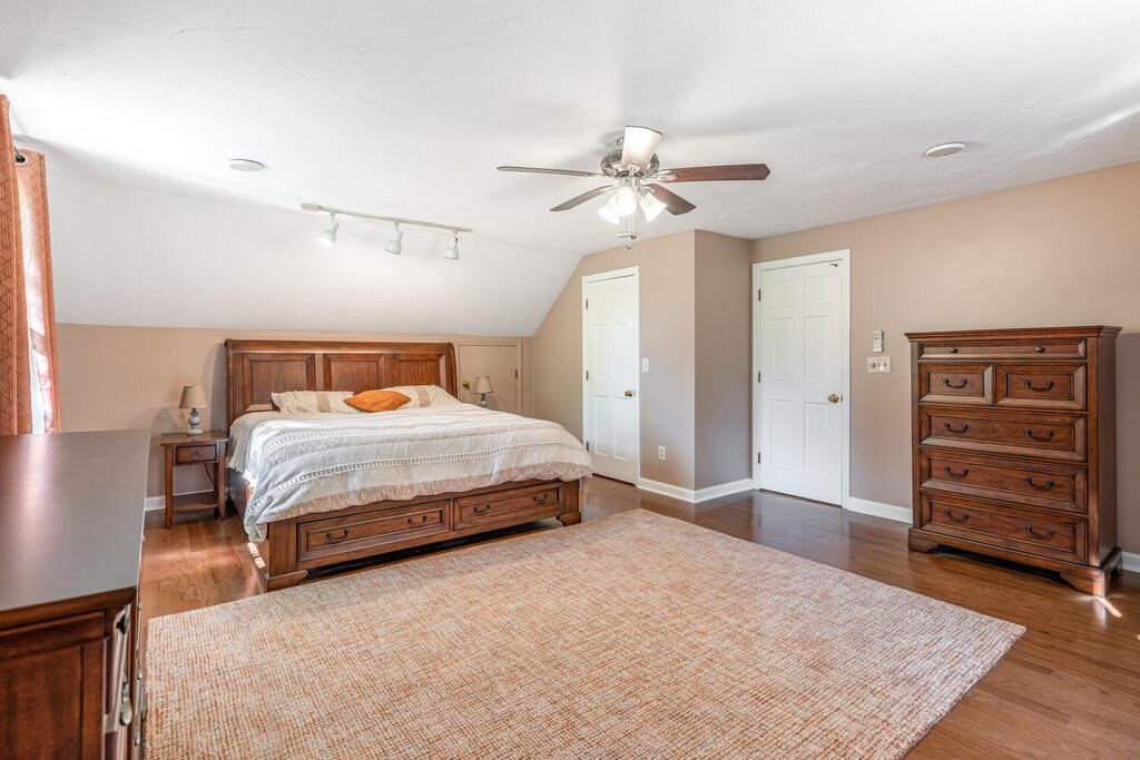 172 Virginia Road Waltham, MA 02453 - Photo 18 of 26 a bedroom with a bed and a dresser