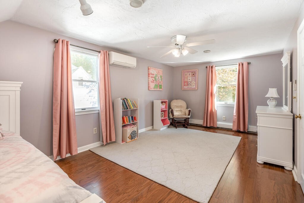 172 Virginia Road Waltham, MA 02453 - Photo 22 of 26 a bed room with a bed and a window