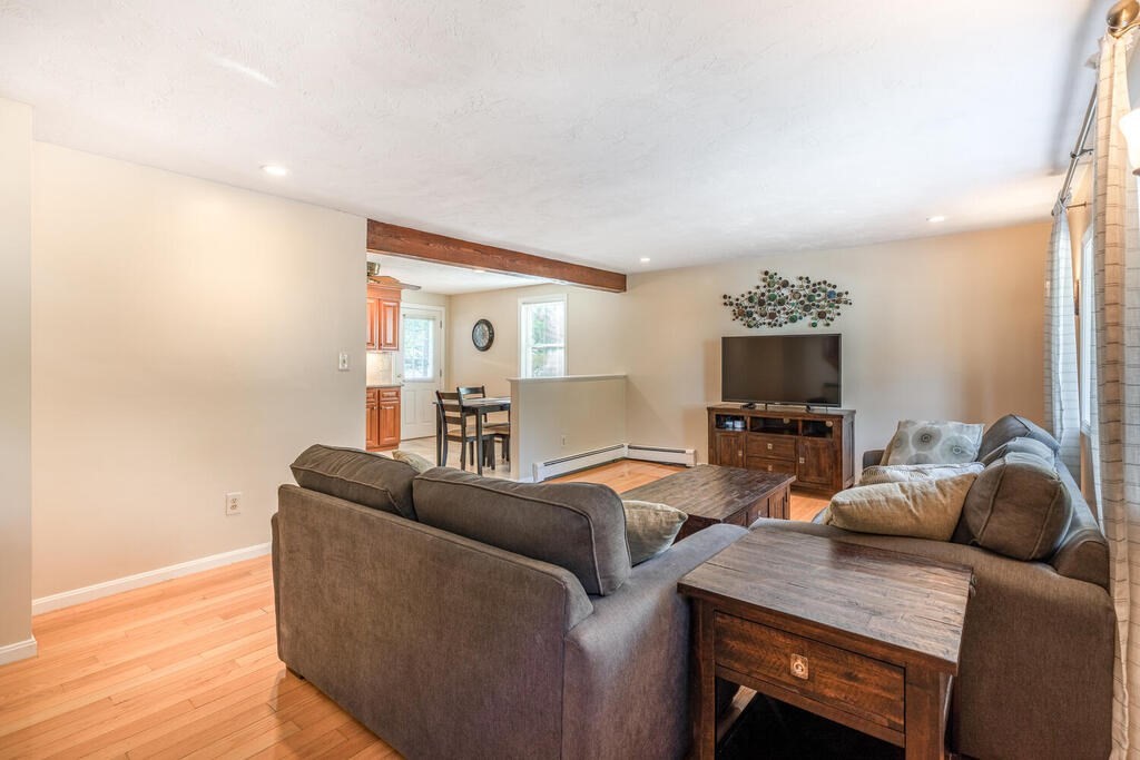 172 Virginia Road Waltham, MA 02453 - Photo 3 of 26 a living room with furniture and a flat screen tv