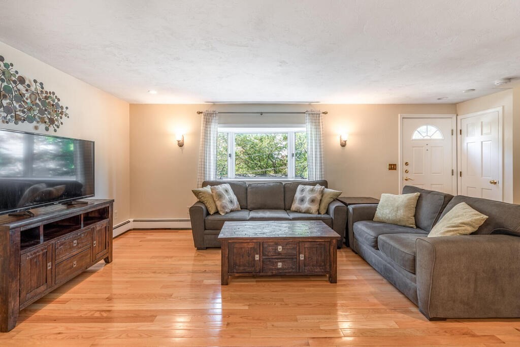 172 Virginia Road Waltham, MA 02453 - Photo 5 of 26 a living room with furniture and a flat screen tv