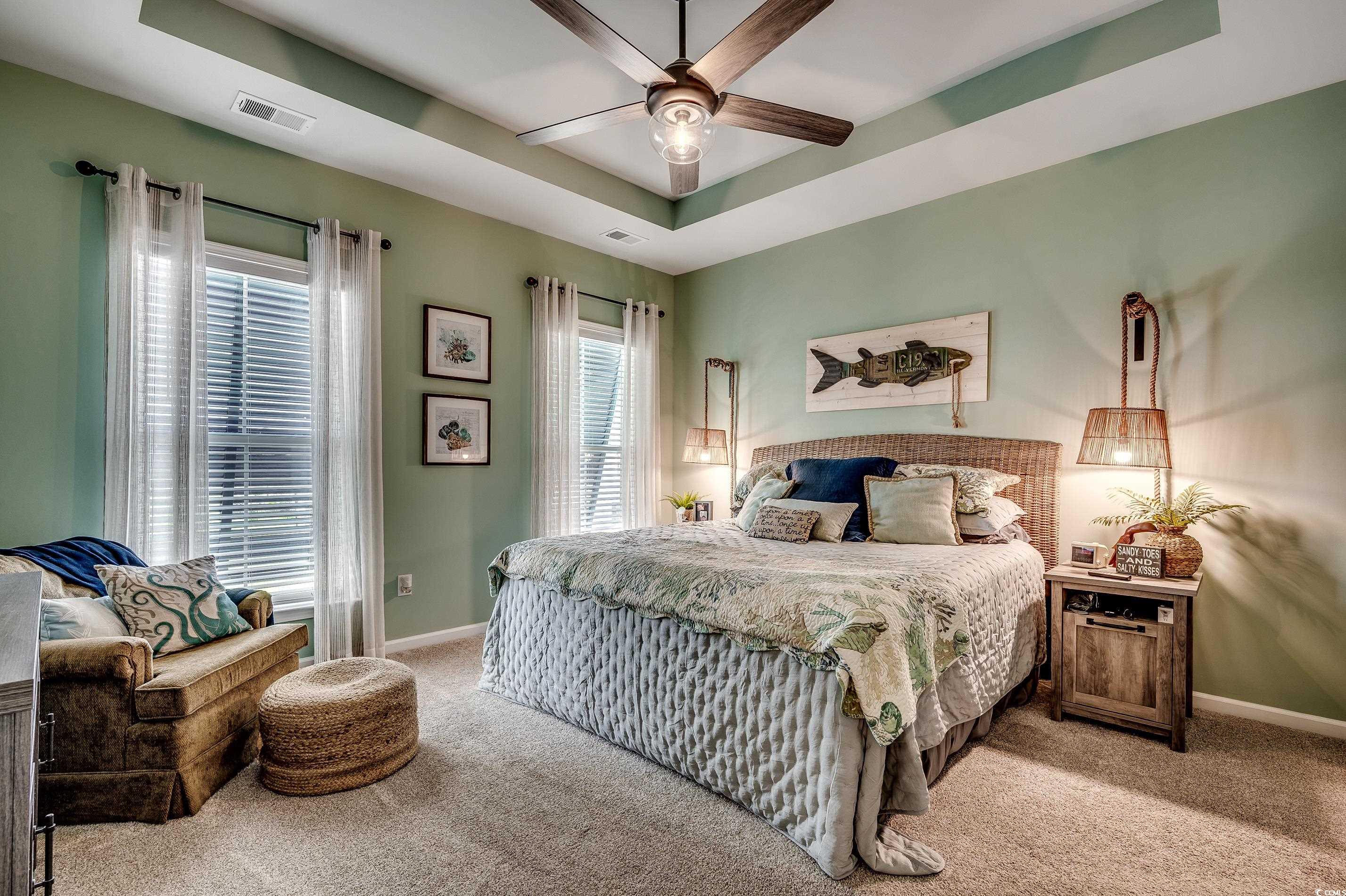 205 Splendor Circle Murrells Inlet, SC 29576 - Photo 15 of 40 Bedroom featuring a tray ceiling, baseboards, visi