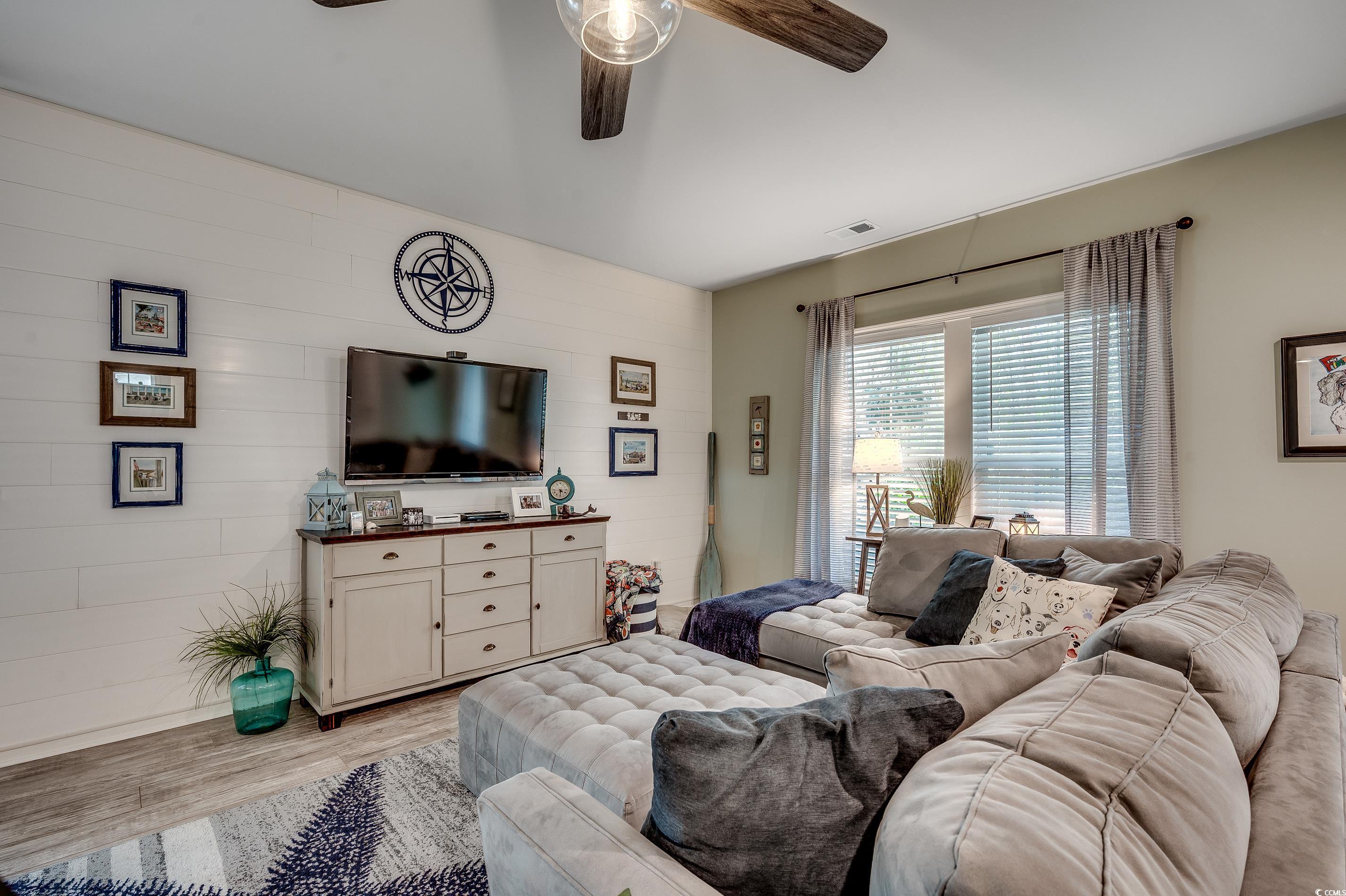 205 Splendor Circle Murrells Inlet, SC 29576 - Photo 25 of 40 Living room with a ceiling fan, visible vents, and