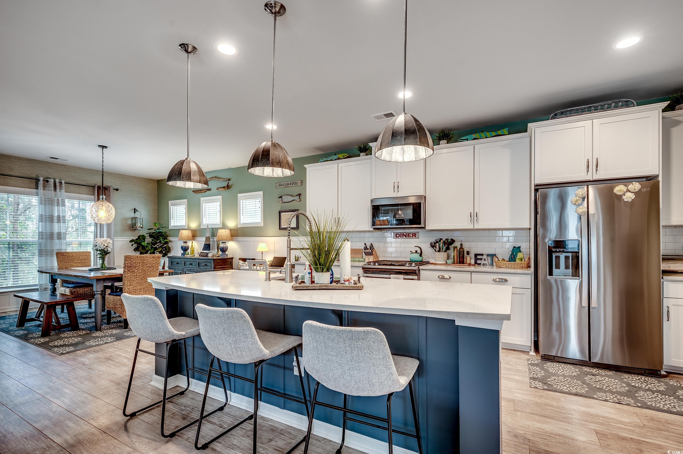 205 Splendor Circle Murrells Inlet, SC 29576 - Photo 5 of 40 Kitchen featuring visible vents, stainless steel a