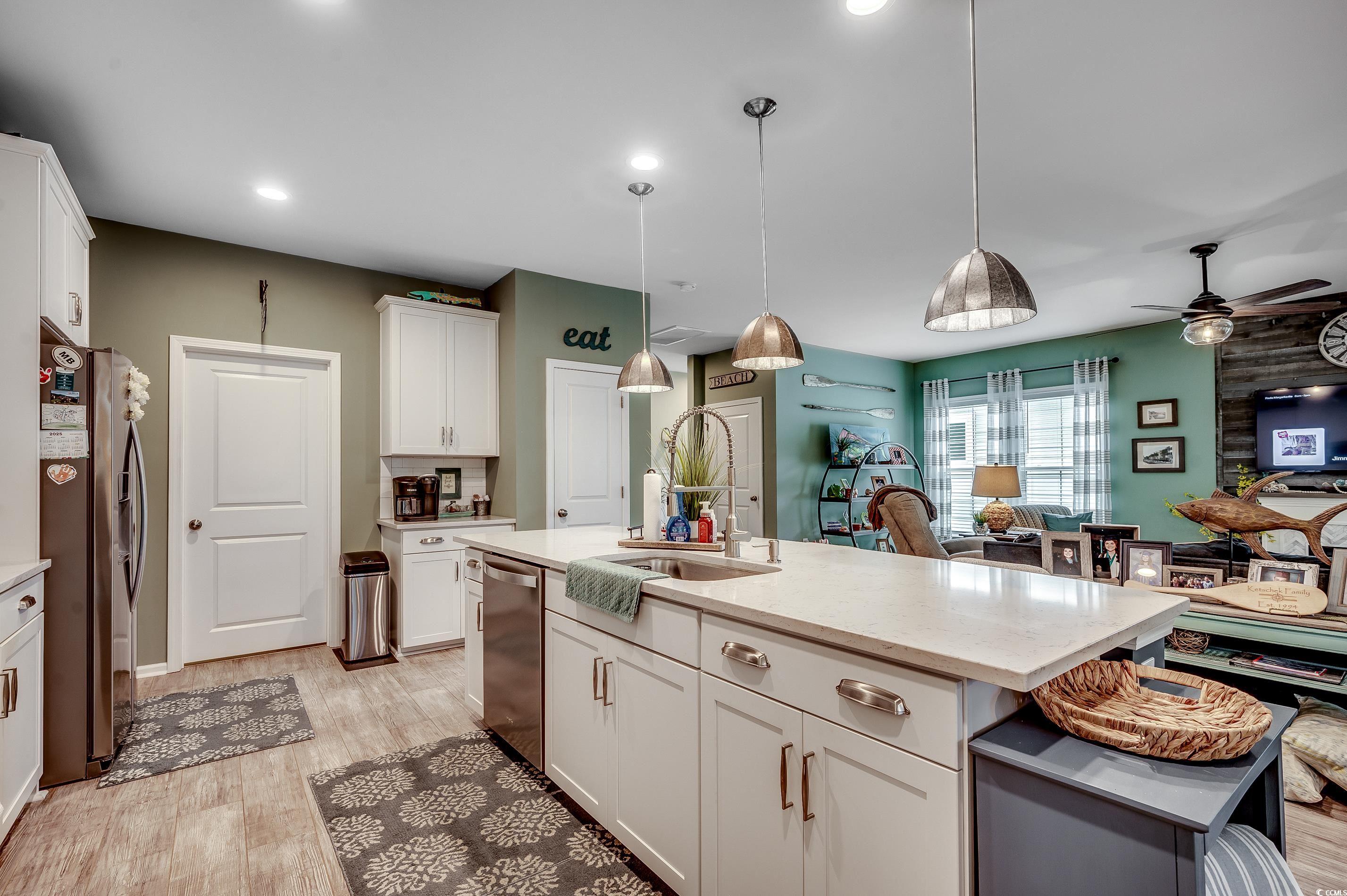 205 Splendor Circle Murrells Inlet, SC 29576 - Photo 40 of 40 Kitchen featuring white cabinetry, open floor plan