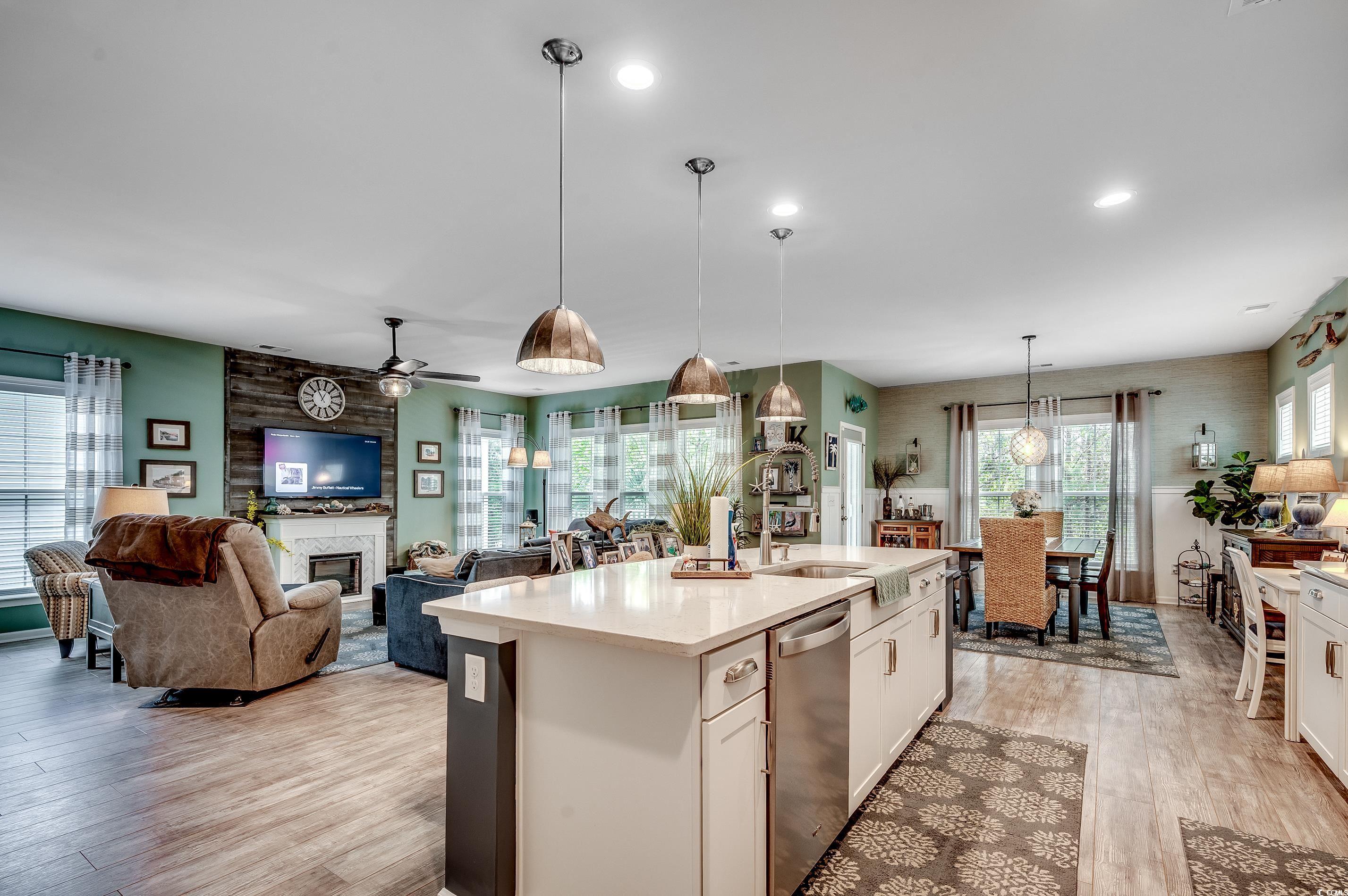 205 Splendor Circle Murrells Inlet, SC 29576 - Photo 6 of 40 Kitchen with an island with sink, a large fireplac