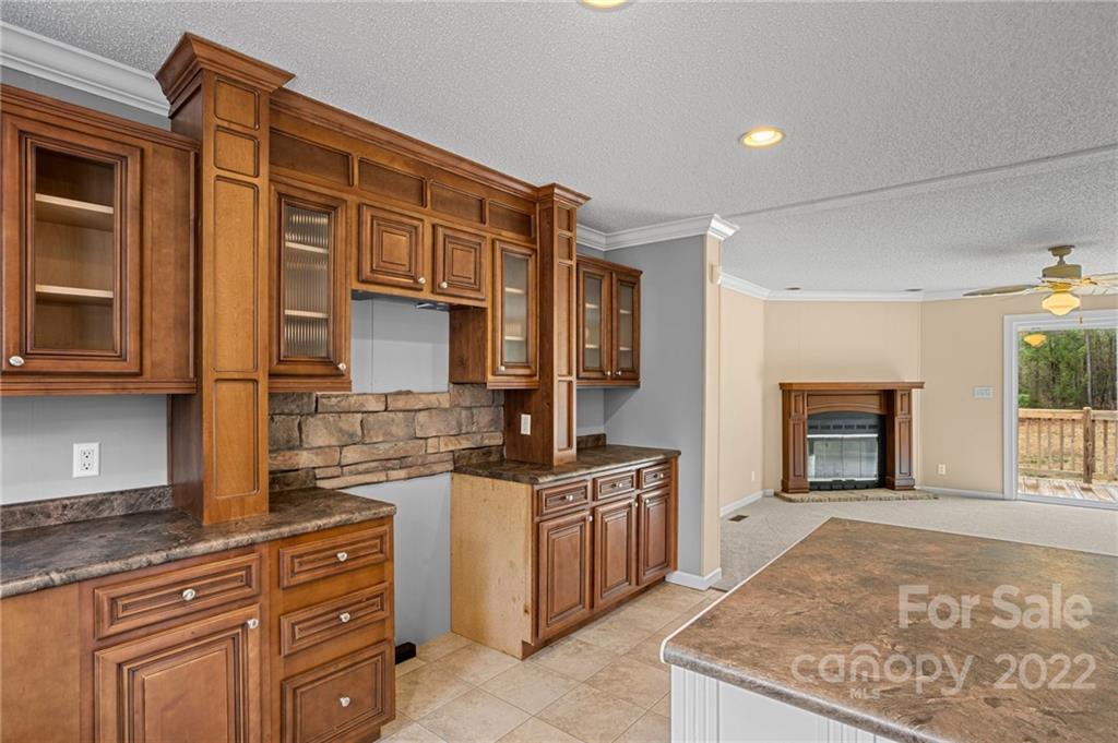 3205 Unity Church Road Lancaster, SC 29720 - Photo 13 of 45 a kitchen with stainless steel appliances granite countertop a stove top oven