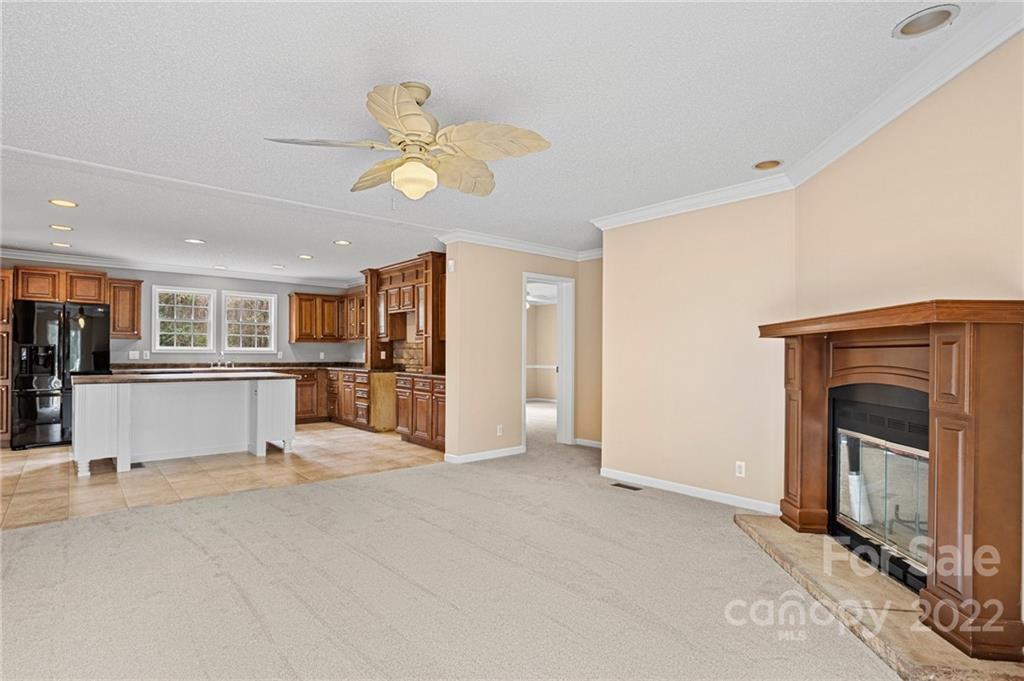 3205 Unity Church Road Lancaster, SC 29720 - Photo 15 of 45 a view of a kitchen with a sink and a fireplace