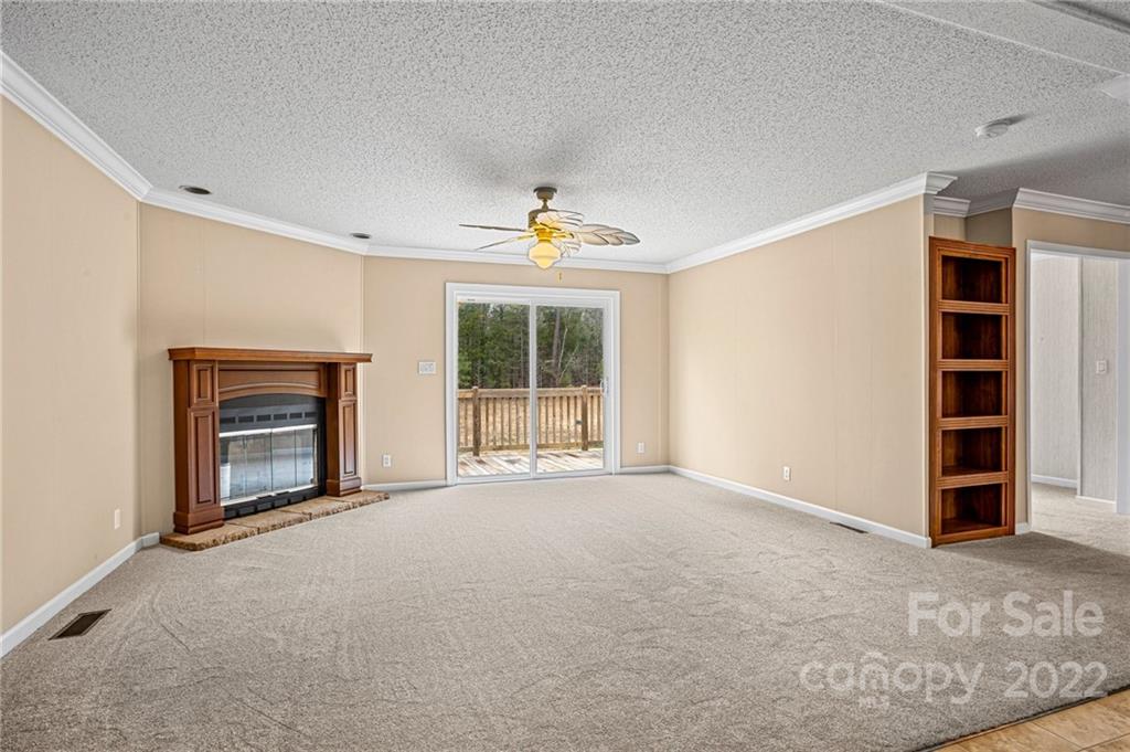 3205 Unity Church Road Lancaster, SC 29720 - Photo 17 of 45 a big room with closet and a fireplace