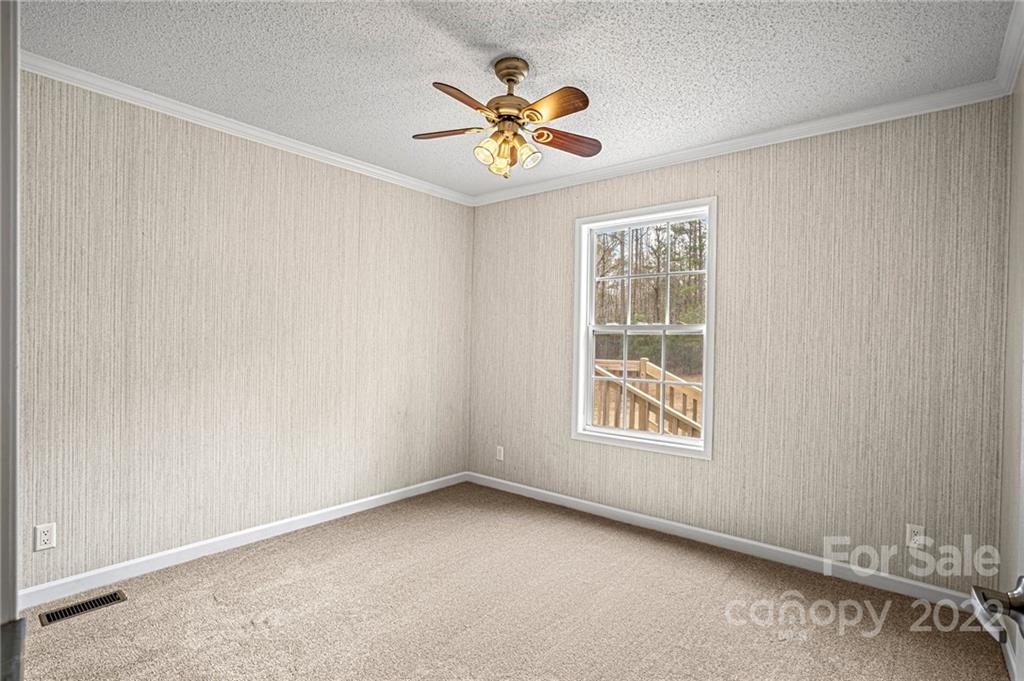 3205 Unity Church Road Lancaster, SC 29720 - Photo 23 of 45 an empty room with window and ceiling fan