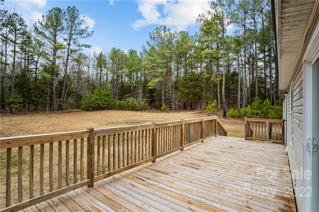 3205 Unity Church Road Lancaster, SC 29720 - Photo 26 of 45 a view of a wooden deck and trees with wooden fence