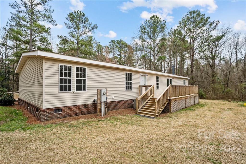3205 Unity Church Road Lancaster, SC 29720 - Photo 28 of 45 a view of a house with a yard and roof