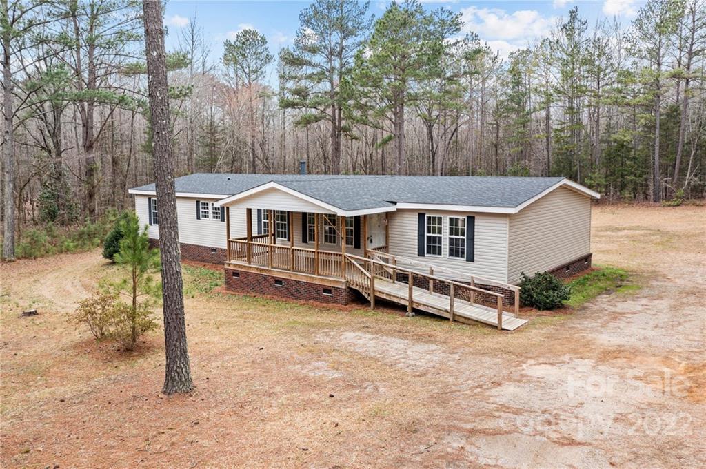 3205 Unity Church Road Lancaster, SC 29720 - Photo 31 of 45 a aerial view of a house with yard and trees in the background