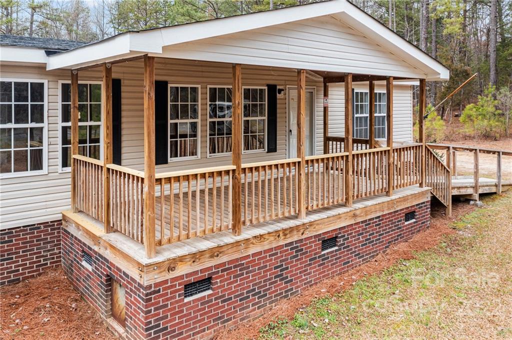 3205 Unity Church Road Lancaster, SC 29720 - Photo 34 of 45 a view of a house with wooden deck