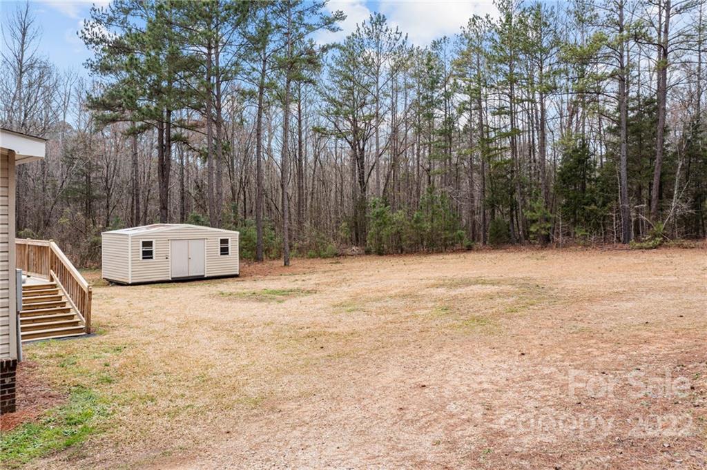 3205 Unity Church Road Lancaster, SC 29720 - Photo 36 of 45 a backyard of a house with lots of green space