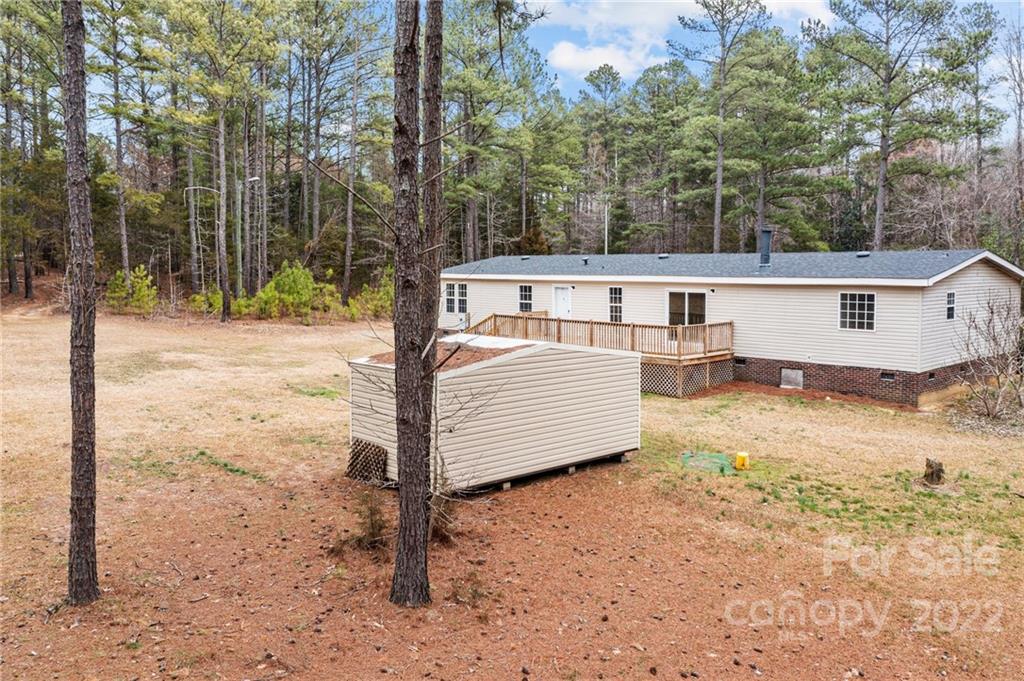 3205 Unity Church Road Lancaster, SC 29720 - Photo 39 of 45 a view of a house with backyard and trees